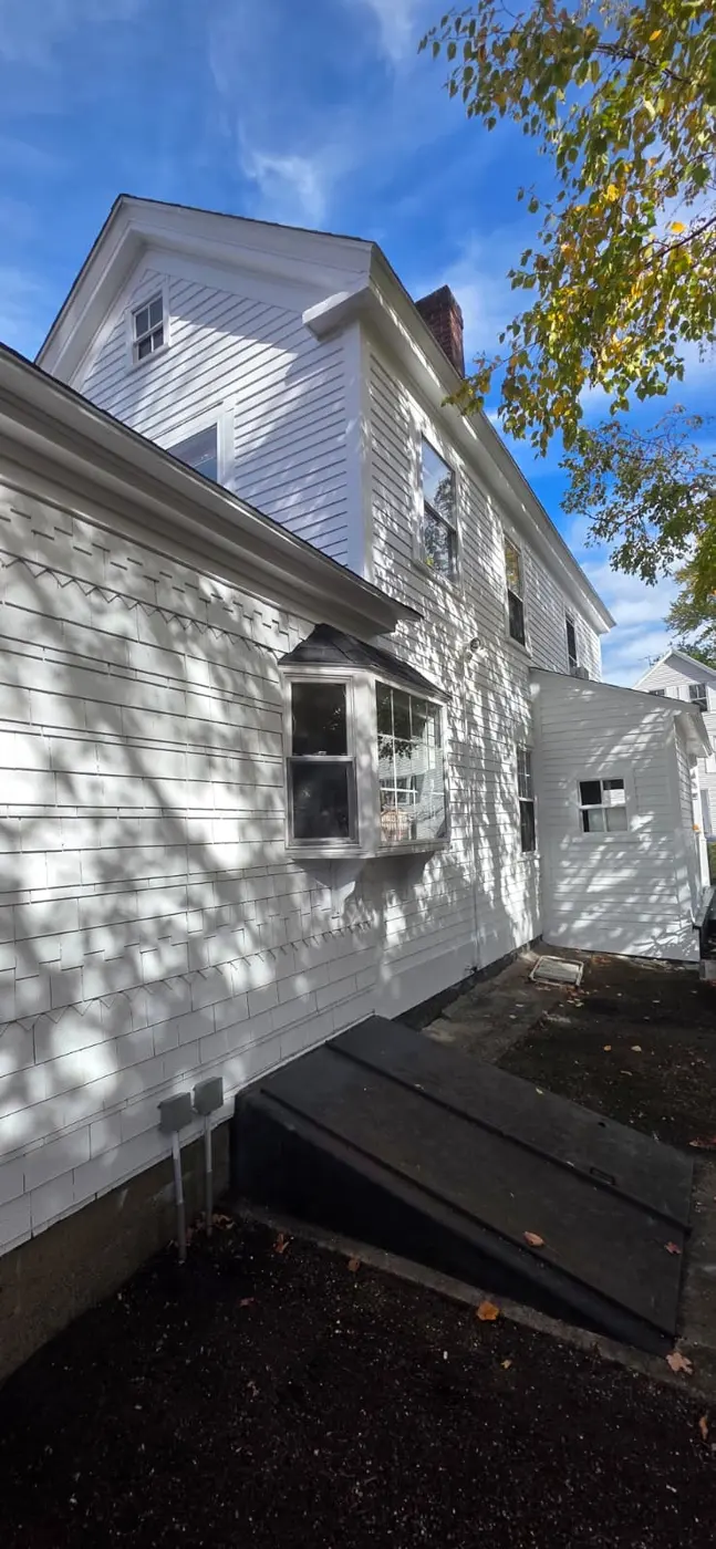 After: the side wall finished in fresh white